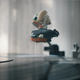 A still from Marcel the Shell With Shoes On showing Marcel on top of a vinyl record needle